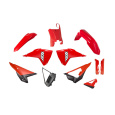kompletní sada plastů (vc. chráničů vidlic) REVOLUTION HONDA, RTECH (červená-černá) 